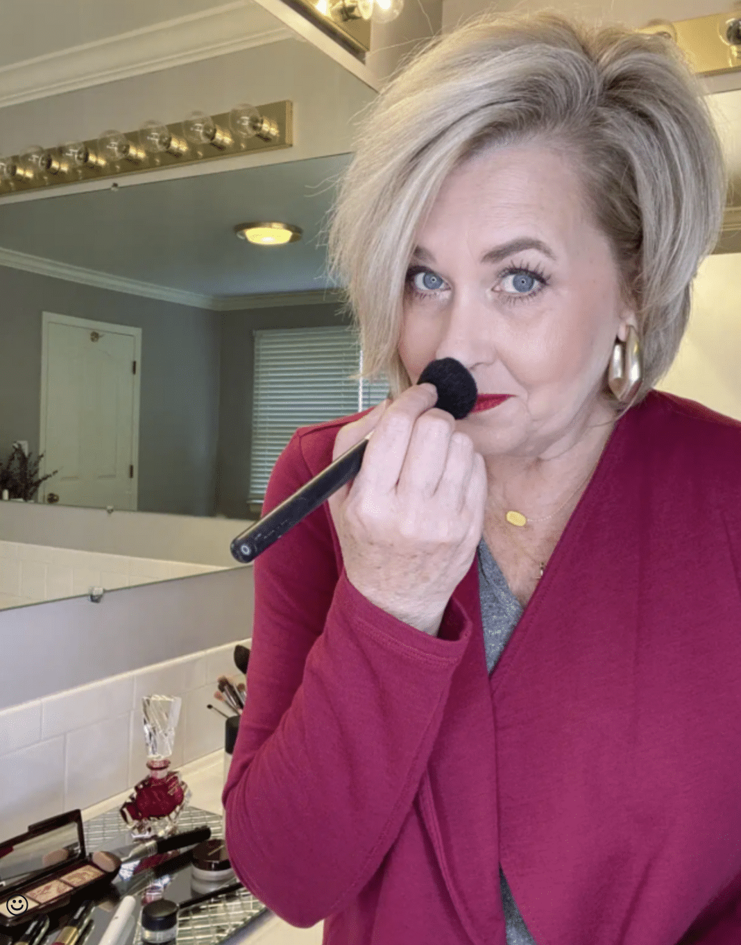 Tania Stephens putting setting powder on her nose